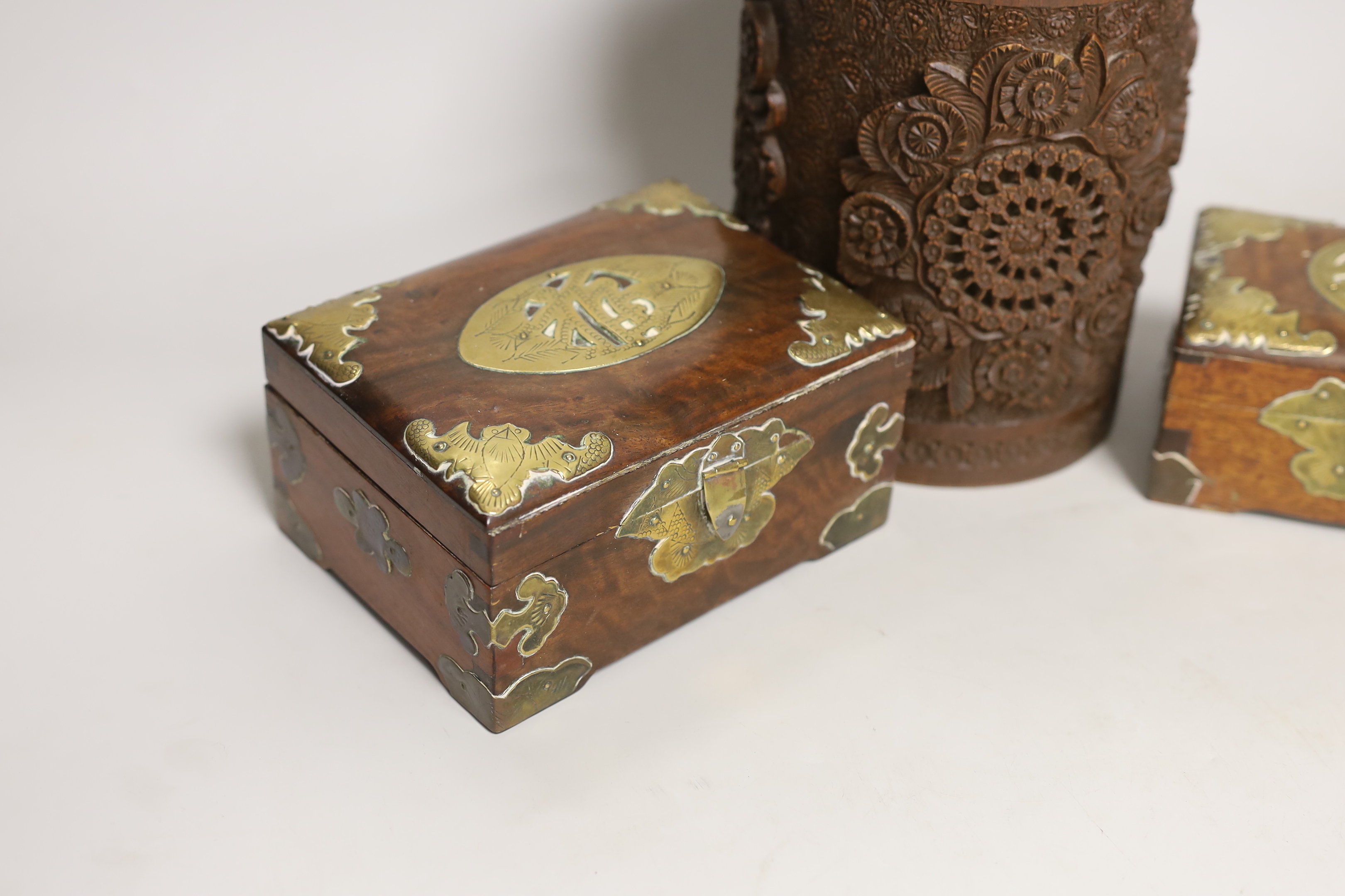 An Indian carved wood humidor and two Chinese brass mounted boxes, tallest 22cm high